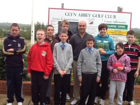Glyn Abbey golf professional Mike Davies with pupils from Maes-Yr-Yrfa School