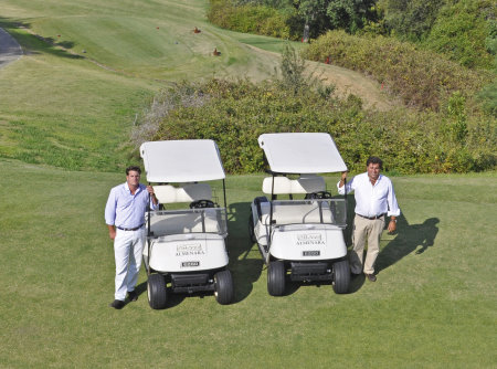 General manager Lucas de la Puente with Pedro Moran of Green Mowers and the E-Z-GO TXT buggies at Almenara Golf Club