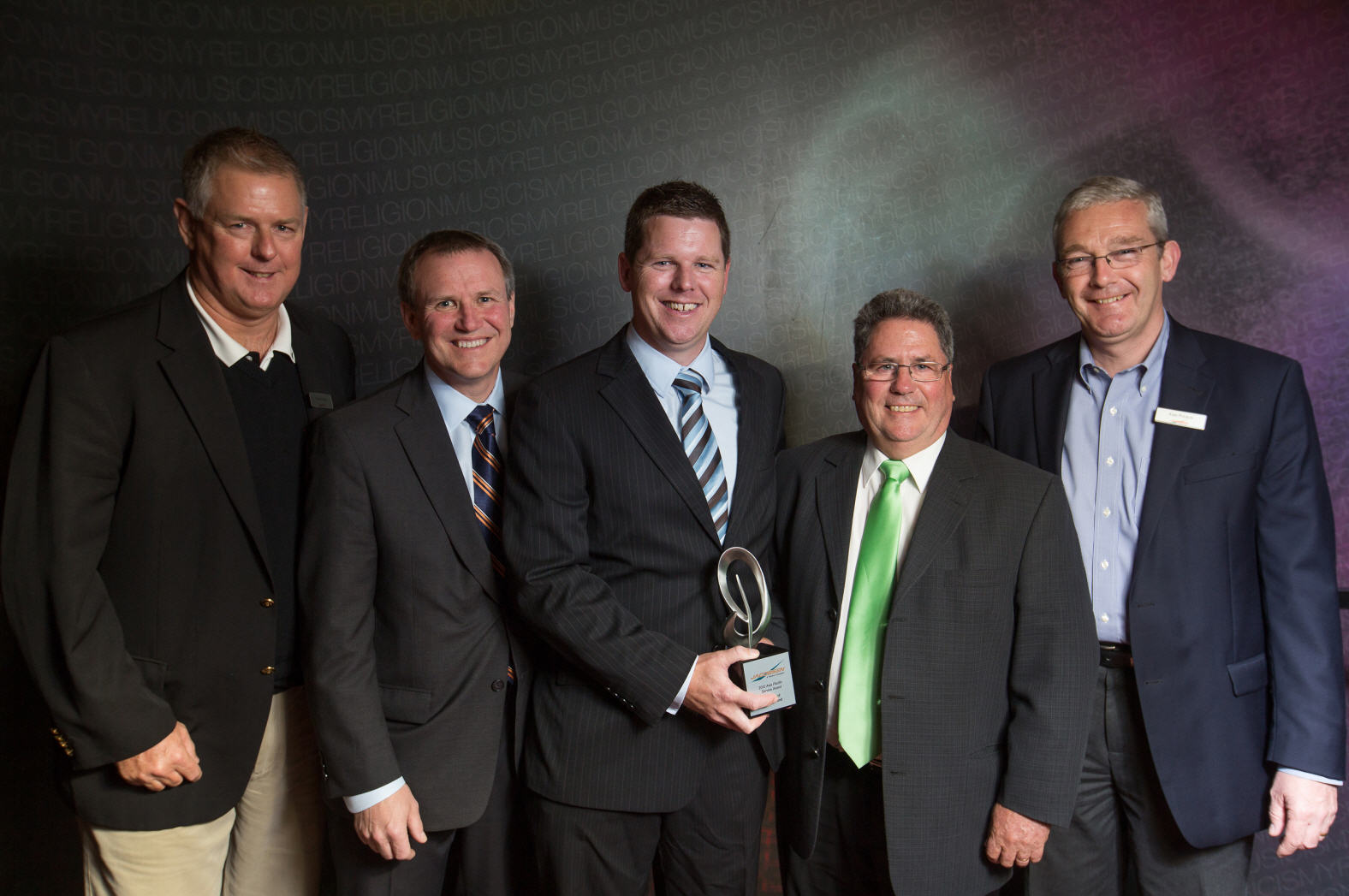 Power Turf New Zealand Ltd  are presented with the Service Dealer of the Year award