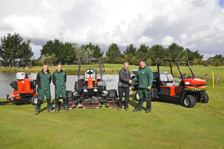 Dave Bush of Ernest Doe & Sons hands over the new equipment to Rustington’s course manager Grant Burger (far right)