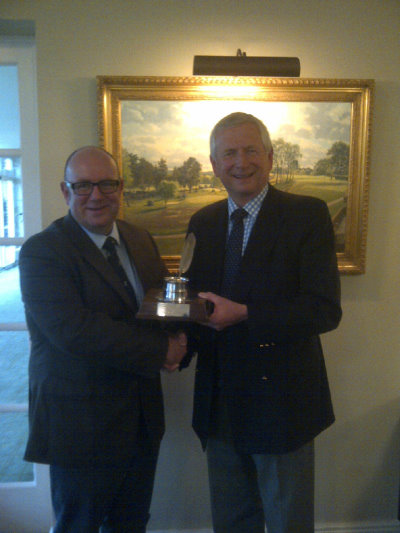 Mike Harris of the AGW (left) congratulates Golf Foundation Chairman Charles Harrison
