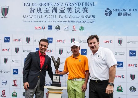 Luo Xue-Wen of China receives the Faldo Series Asia trophy from Sir Nick Faldo and Tenniel Chu, Vice Chairman of Mission Hills Group at Mission Hills Golf Club in Shenzhen, China.