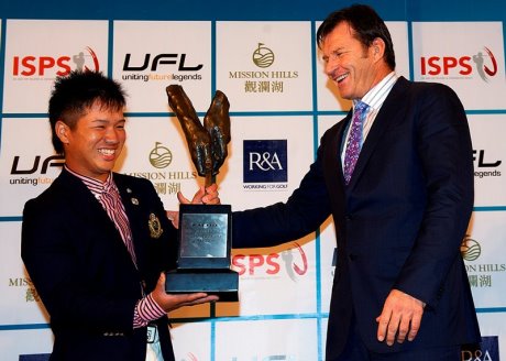 Masamichi Ito of Japan receives the 2012 Faldo Series Asia trophy from Sir Nick Faldo at Mission Hills Golf Club in China