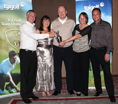  Chris Gray (left) and his team - Carol Gray, Andy Woodhead and Maxine Woodhead - are presented with their trophy by Giles Birkhead, TMaG Regional Sales Manager (centre)