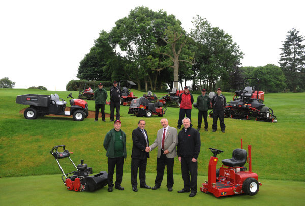 Front from left are Brian Owen, Lely’s John Pike, Tim Nunneley, golf club chairman, and Lely’s Robert Rees, with the greenkeeping team looking on