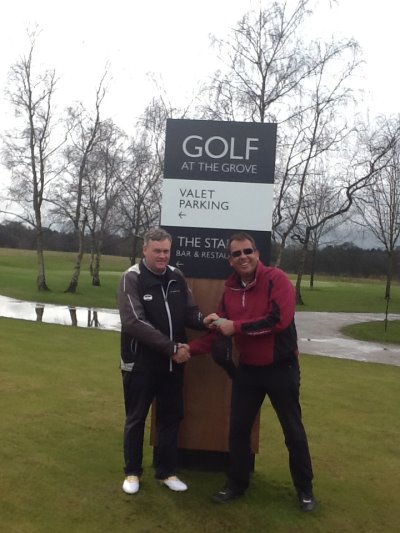 Kevin Merry (left), Senior Golf Instructor at The Grove presents Troon Reward Member, Edward Page with his new Troon Platinum Membership Card.