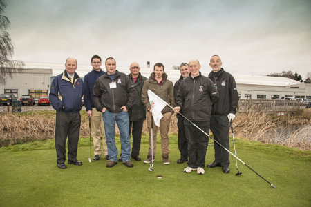 Craig Cameron (holding flag) following his hole-in-one on the RJ National, with other members of the Aldeburgh greenkeeping team, Nigel Church of Ransomes Jacobsen and Adrian Kersey of Bartram Mowers