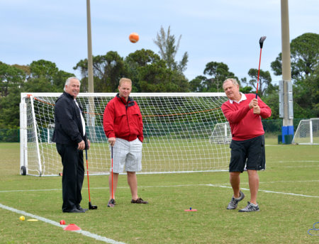 Jack Nicklaus trials the clubs with SNAG Golf's Terry Anton (centre)