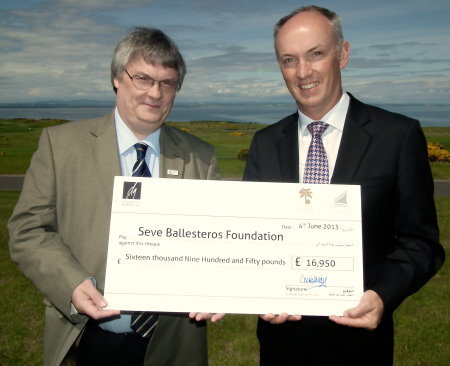 Dubai Golf’s Chief Executive Officer, Christopher May, presents the cheque for £16,950, to Richard Cowie from Cancer Research UK, which works in partnership with the Seve Ballesteros Foundation. The presentation took place in St Andrews, Scotland, where Seve won The Open Championship in 1984