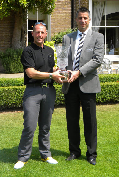 Craig Thomas (left) collecting his award from PGA in England (Midlands) secretary James Brown