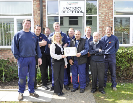 Gemma Cosby with Ransomes Jacobsen’s health and safety committee and the company’s gold award certificate