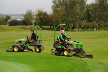 Course manager Chris Allen (right) and assistant manager Jamie Cushnaham operate The Wiltshire's two John Deere 2635B tees & surrounds mowers.