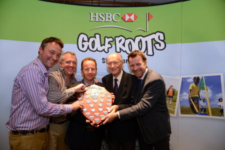 The winning team of Dynamo Silver led by Pro Robert McGuirk (centre) receives the Wickham Shield from Hugh Wickham (second from right).