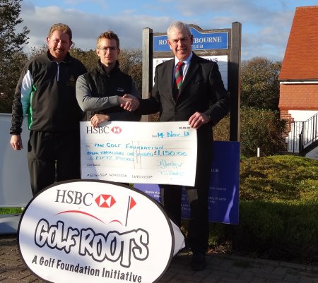 Royal Eastbourne's Head Professional Alan Harrison (left) and club secretary David Lockyer (right) present the donation to Golf Foundation Regional Officer Andy Wright