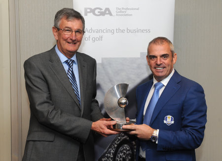 Paul McGinley receiving the PGA Recognition Award from PGA captain Neil Selwyn-Smith. (image courtesy of Tom Dulat/Getty Images)