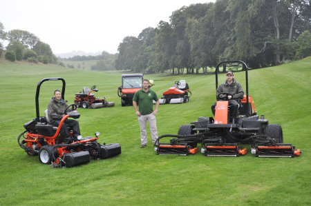 Course manager Dan Robinson (centre) with the club’s new acquisitions, a Jacobsen GP400 and Fairway 305