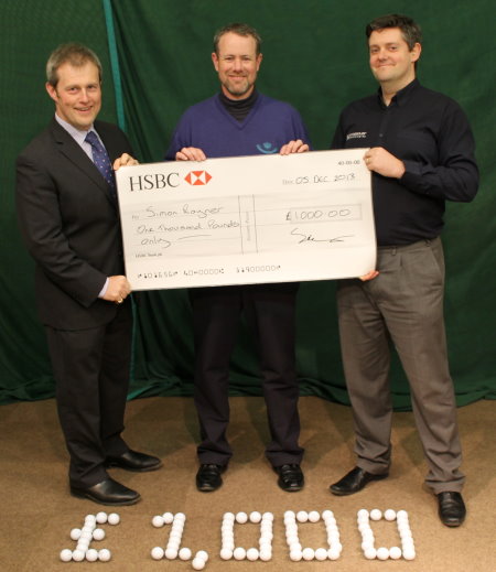 Royal West Norfolk Head Professional Simon Rayner (centre) is presented with his cheque by Phil Barnard, Crossover Technologies’ Managing Director (left) and Mark Hopkins, Crossover Sales Manager