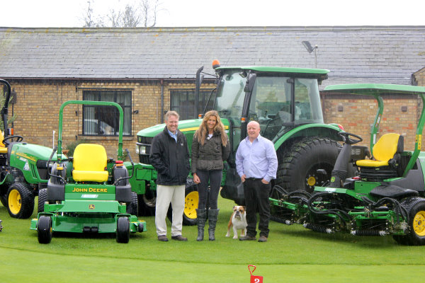Thorney Lakes Golf Centre course manager Sid Matthews (right) and owner Jane Hind with Ben Burgess dealer salesman Chris Pateman (left) and part of the new John Deere fleet in front of the clubhouse