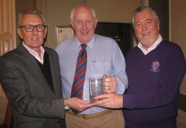 Brian Pierson (centre) is presented with a gift from the BAGCC by the association’s founder and golf course architect Howard Swan (left) and its new Chairman Mike Pomfret