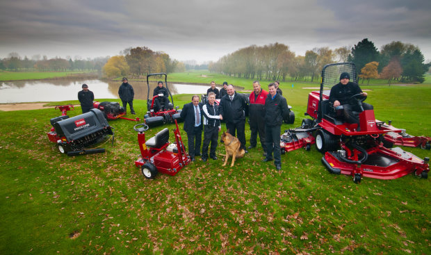 Angus MacLeod, front, second left, director of golf courses and estates at The Belfry, shakes hands with Lely’s Jon Lewis. From left to right: John Pike, Lely, Chris Minton, workshop manager at The Belfry, Graham Hall, managing director of Redtech, and the greenkeepers.