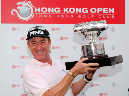  Miguel Angel Jimenez of Spain celebrates with the trophy after winning the 2013 Hong Kong Open  (Photo by Ian Walton/Getty Images)