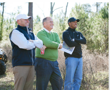 (L to R) BeaconLand Development partners Casey Paulson and Michael Abbott meet with Tiger Woods during a site visit of Bluejack National's future golf course. (Photo: Business Wire)