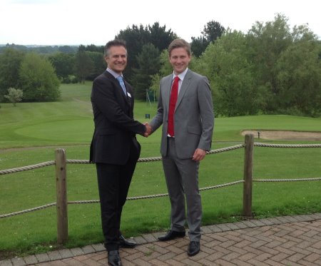 Rob Saunders of Teeofftimes.co.uk (right) shakes hands on the arrangement with Mytime Active’s Brad Chard (left) at Dibden Golf Centre