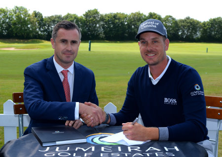 Henrik Stenson with Neal Graham, Jumeirah Golf Estates General Manager, Club Operations and the UAE flag at the ‘Official Ambassador’ signing ceremony