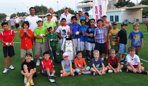 MENA Golf Tour professional and golf in DUBAi ambassador Zane Scotland (extreme left, back row) with some of the young enthusiasts after conducting a golf clinic on the sidelines of the tour’s event in Qatar in 2013
