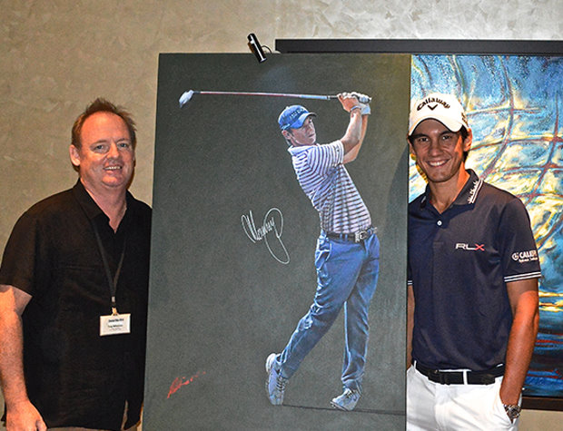 Mark Robinson is pictured with Matteo Manassero and one of his portraits 