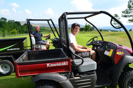 Morlais Castle Golf Course Head Greenkeeper Dave Roberts, left, and Assistant Greenkeeper Tom Frampton with two of the vehicles purchased with SEWCED funding