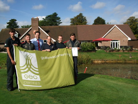 Aldwickbury Park Golf Club General Manager Andrew Shewbridge (centre) and the greenkeeping team hold aloft the GEO Certified flag
