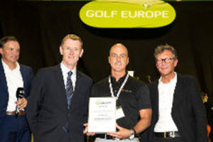 Tim DeJarlais for Swing Catalyst (centre) receives the award from Tony Bennett, director of education for the PGA of Europe (left) and Gerhard Reiter, CEO of Messe Augsburg (right)