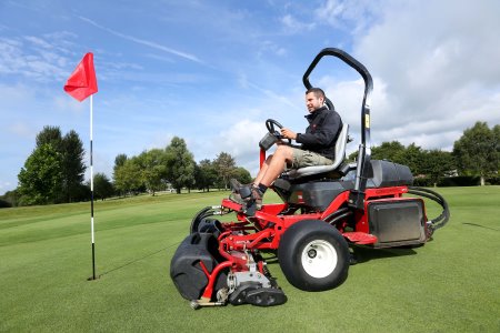 Greenkeeper at Highwoods Golf Club operating the recently purchased Toro Greensmaster 3250.
