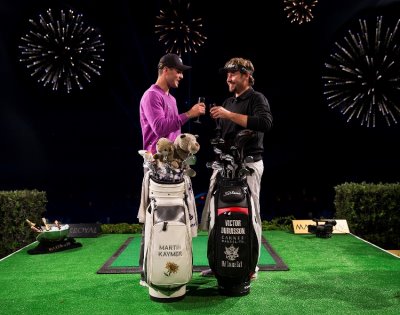 Martin Kaymer and Victor Dubuisson celebrate the Maxx Royal Target Challenge