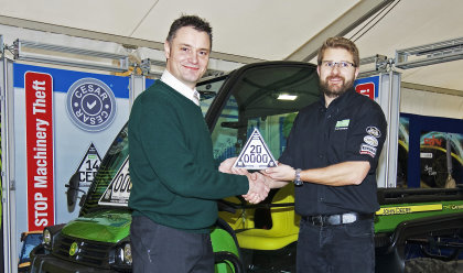 John Deere Limited marketing manager Chris Wiltshire (left) and Datatag sales manager Chris Harrison with the 200,000th CESAR marked machine, a John Deere XUV 855D Gator utility vehicle, on the CESAR Scheme stand at LAMMA 2015