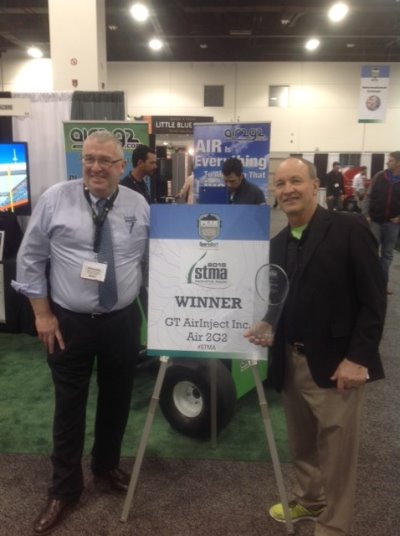 Richard Campey (left) and Air Inject President Glen Black receive the STMA award for the Most Innovative Product