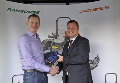 Fairways GM Managing Director, David Rae receives the Jacobsen sales award from Rupert Price