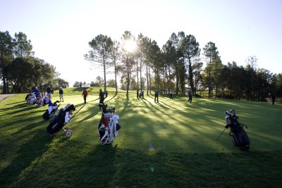Golfers on the putting green at PGA Catalunya Resort