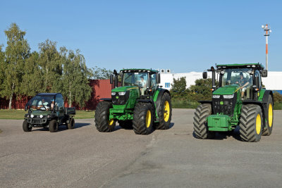 Melissa Reid, Caroline Masson and Maria Hjorth take instruction on driving the John Deere Gator and 6R & 7R Series tractors at the company’s Bruchsal test track in Germany
