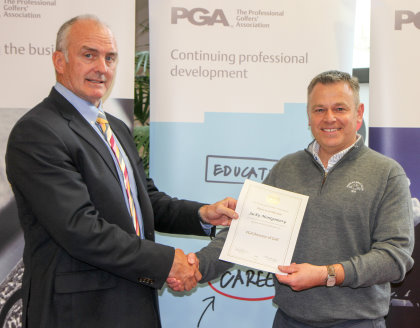 Dr Kyle Phillpots, left, presenting the PGA director of golf certificate to Jacky Montgomery (picture courtesy of Adrian Milledge)