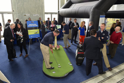 Michael Breed (pictured right) gives Congressional Members and staffers free lessons throughout the day in a simulator. The “Republicans vs. Democrats” putting challenge is now an annual event (Photo by Stan Badz/PGA TOUR)