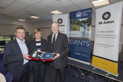 St Johns donate a mobile defibrillator to Hamish Grey, Chief Executive SGU and Karin Sharp, Chief Operating Officer SLGA as part of an initiative to introduce them into golf clubs (Kenny Smith Photography)