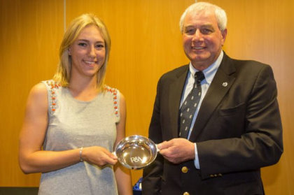 Rosie Davies is presented with a traditional Scottish quaich by David Bird, member of the R&A Rules Panel