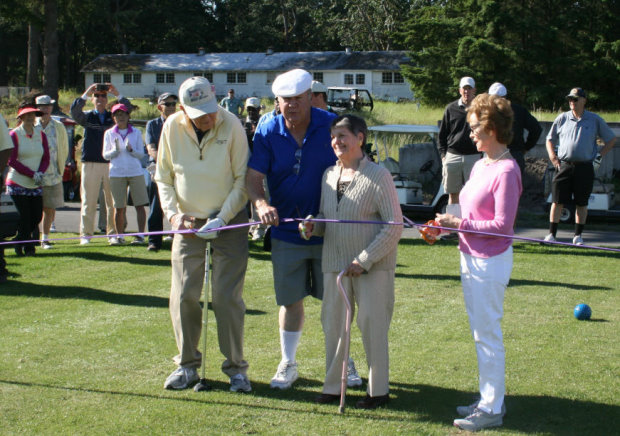 A ribbon cutting was held on the 10th tee featuring Ken Still, Assistant Course Manager Roger Gatts, and the Tatum sisters—whose father, Joe, cut the ribbon for the original nine