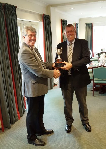 Highspeed's MD David Mears (left) presents the CourseCare Cup to Kevin Pickett GCMA Wessex Captain