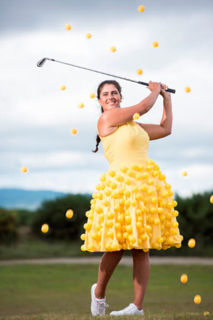 Scottish golf star Kelsey Macdonald has a ball by Wearing It Yellow ahead of the Aberdeen Asset Management Ladies Scottish Open in a dress made from golf balls. Spectators at the tournament are being urged to don yellow clothing to show their support for The Beatson Cancer Charity – the official charity of the event for the second year in a row