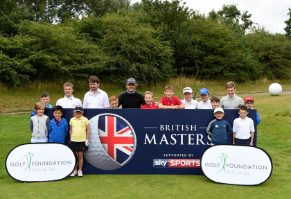 Eddie Pepperell and the kids pose for photographs during the British Masters charity launch at The Grove Hotel on August 10, 2016 in Hertford, England. (Photo by Tom Dulat/Getty Images). 