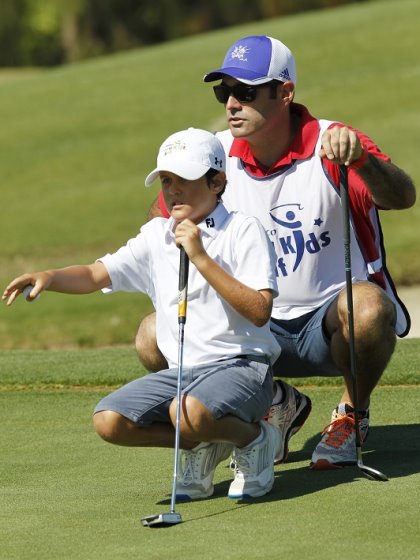Kostka Horno receives some advice from his caddy