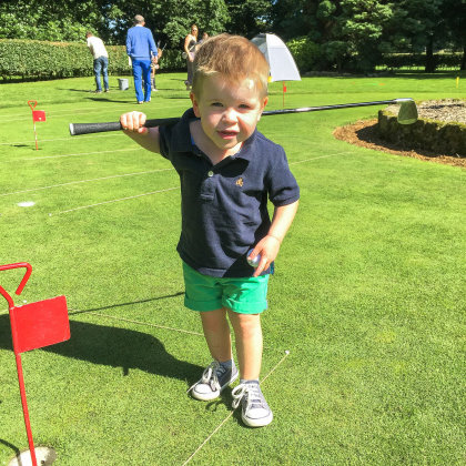A young first-time golfer tries chipping at Duxbury Park GC during the summer Festival of Golf